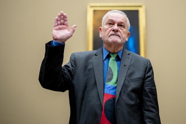 Dr. David Morens being sworn in at a House Select Subcommittee on the Coro<em></em>navirus Pandemic hearing at Capitol Hill, raising his hand