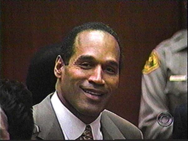 O.J. Simpson reacting with a smile during the reading of verdict at his murder trial