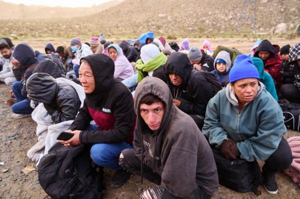 Migrants turn themselves in to Border Patrol at a makeshift camp in Jacumba Hot Springs, California