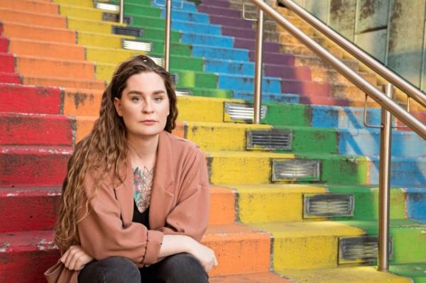 Ugla Stefanía Kristj?nudóttir Jónsdóttir sitting on a rainbow staircase