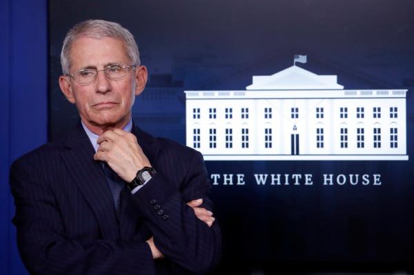 Dr. Anthony Fauci bobblehead in a suit with his hands on his chin, created to raise funds for American Hospital Association.