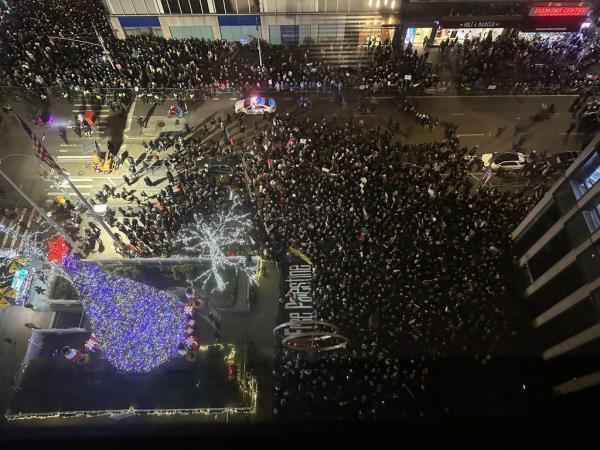 Flood the Tree protestors supporting Free Palestine are pictured outside 1211 Avenue of the Americas, the Fox headquarters, on Sixth Avenue, ahead of the Rockefeller Christmas Tree lighting tonight