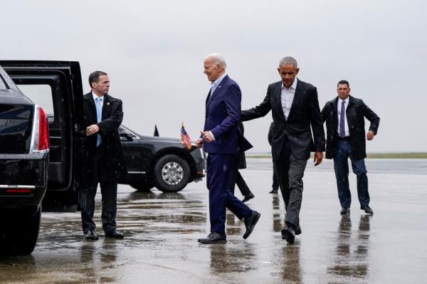 U.S. President Joe Biden and Former U.S. President Barack Obama walk at John F. Kennedy Internatio<em></em>nal Airport  in New York, U.S., March 28, 2024. 