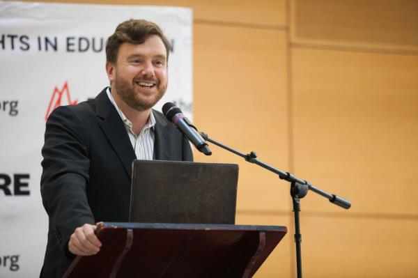 Greg Lukianoff, standing at a lectern