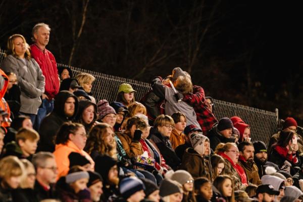 People embrace during a community prayer vigil, Tuesday, Nov. 14, 2023, at the Tuscarawas Valley Schools football stadium in Zoarville, Ohio