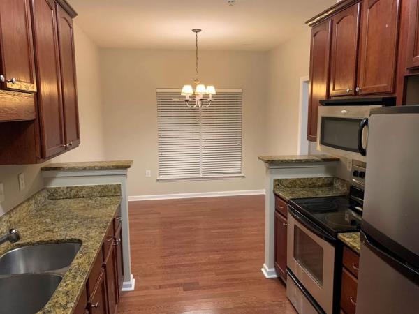 The modest kitchen and dining space. 