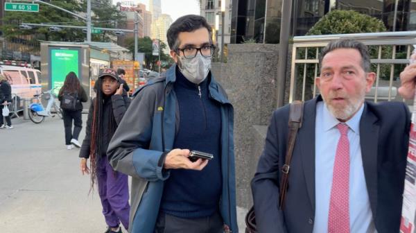 Man in Columbus Circle wearing mask