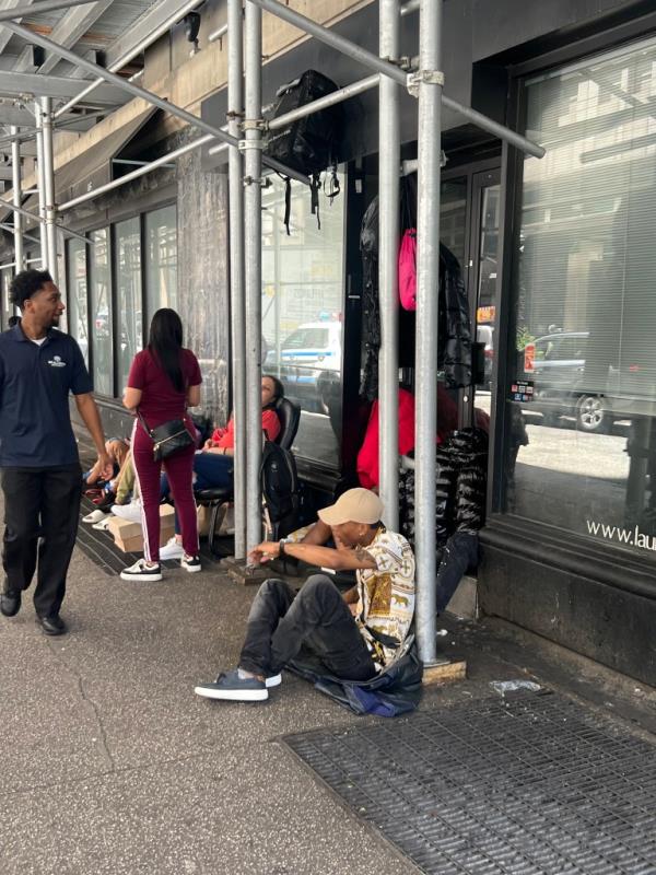 Migrants outside the Roosevelt Hotel earlier this year.