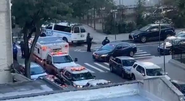 Police at the scene of wher<em></em>e two teen boys were slashed outside of Newcomers High School in Queens on October 11, 2023. 