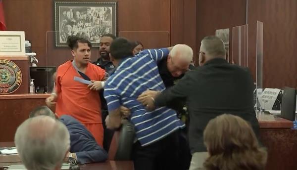 As Machado was being held back, Alvarez's uncle rushed DeLeon and punched the alleged murderer several times.