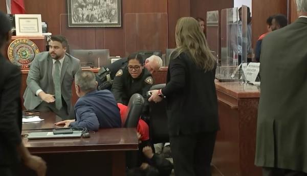  Court employees tackled the man to the ground while DeLeon was ushered to a corner, video captured from outside the courtroom shows.