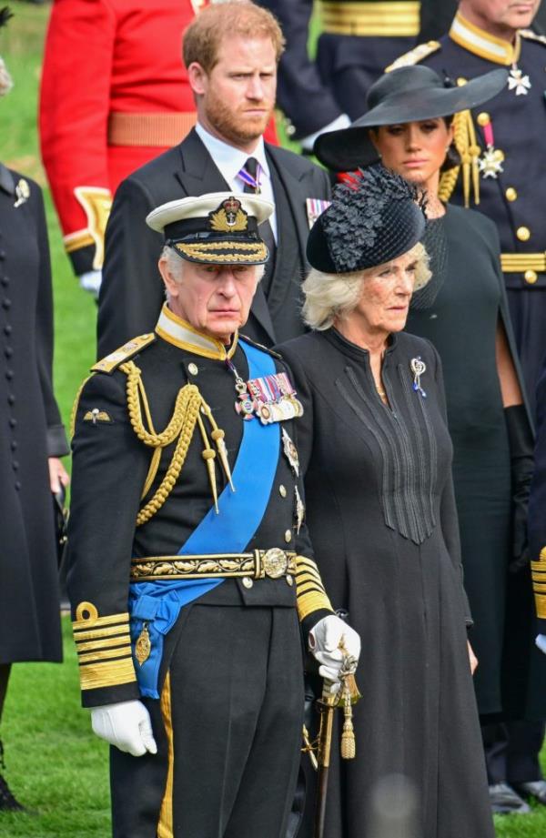 Prince Harry, Duke of Sussex, Meghan, Duchess of Sussex, King Charles III and Camilla, Queen Co<em></em>nsort observe the coffin of Queen Elizabeth II.