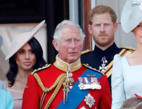 Meghan, Duchess of Sussex, Prince Charles, Prince of Wales and Prince Harry, Duke of Sussex stand on the balcony of Buckingham Palace during Trooping The Colour 2018.