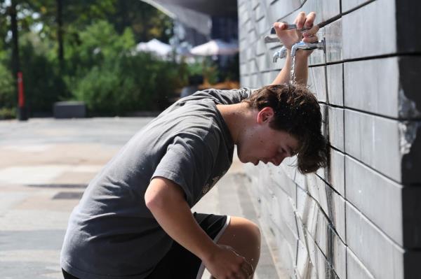 Taylor Sale (40, of Manhattan) does his stretching exercise at Brooklyn Bridge Park waterfront.