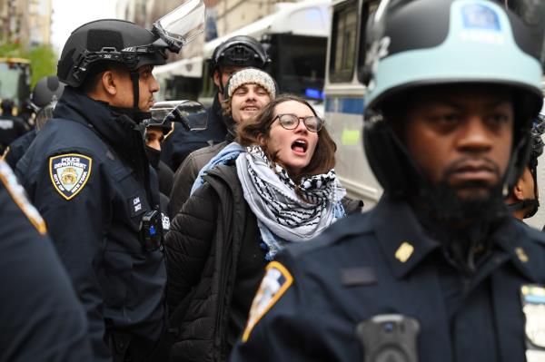 The demo<em></em>nstrators were led into a police van. 