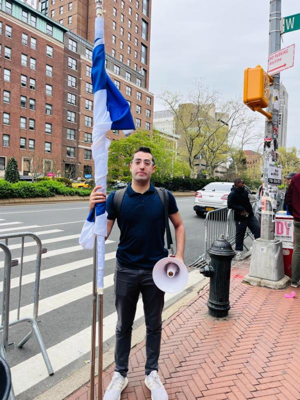 Jo<em></em>nny Lederer holding a flag and megaphone outside Columbia University on May 17, 1924