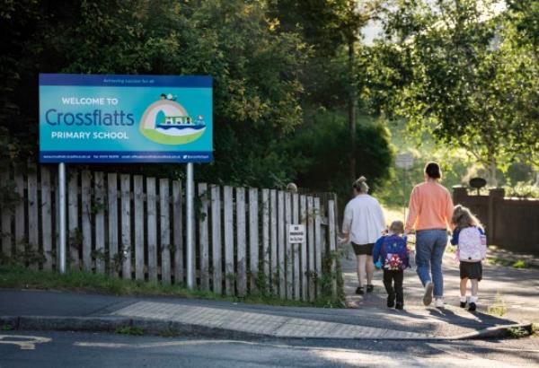 Children arrive at Crossflatts Primary School in Bradford which has been affected by RAAC (Picture: PA)